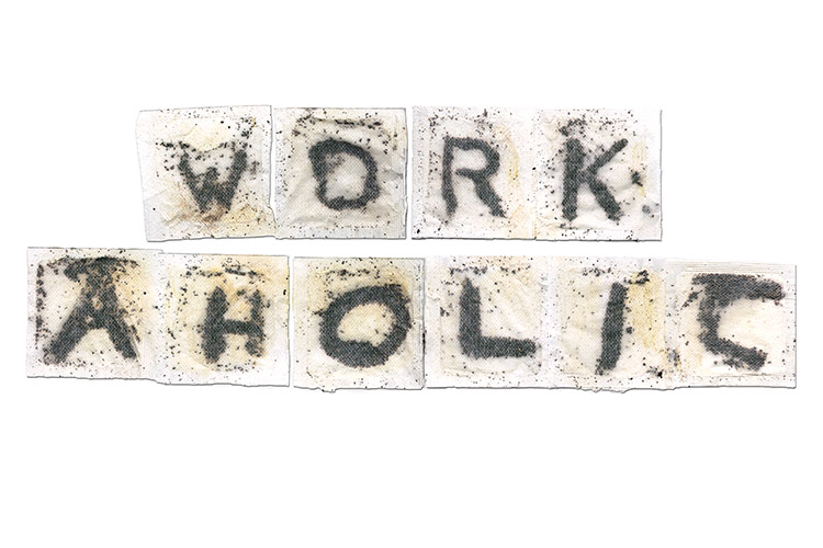 Square teabags with each teabag showing a letter to spell out "workaholic"