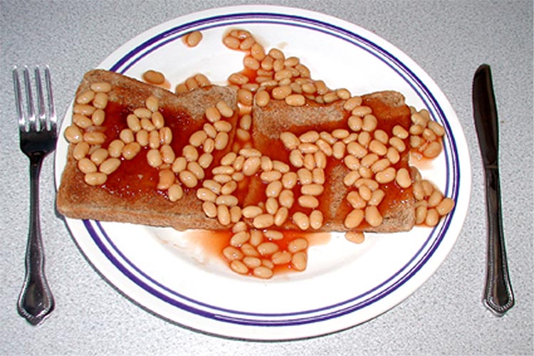 Beans on toast showing the word "work" out of beans