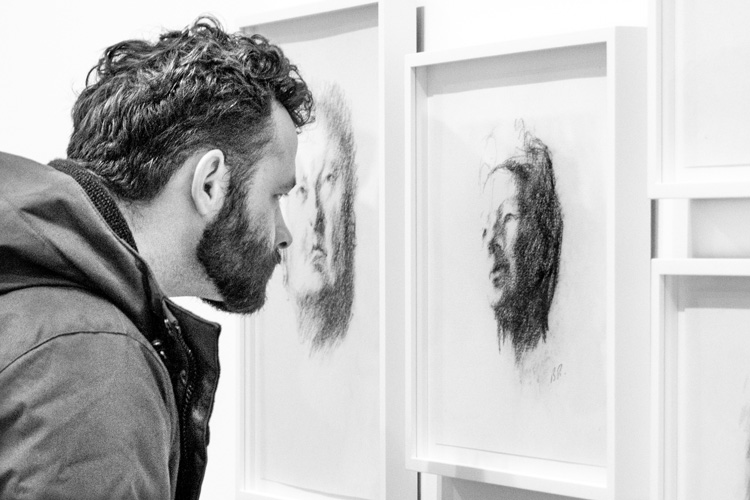When our eyes met - man viewing portrait sketches