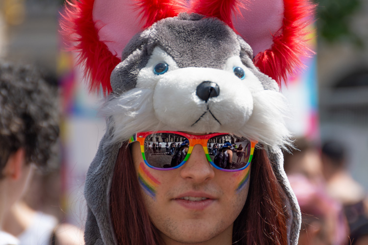Spectator with sun glases and animal headgear