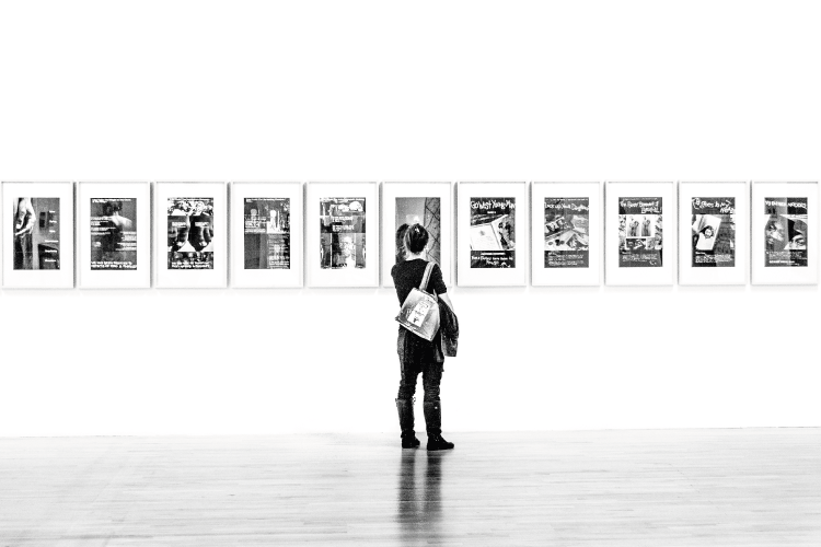 Photograph of a woman alone in an art gallery