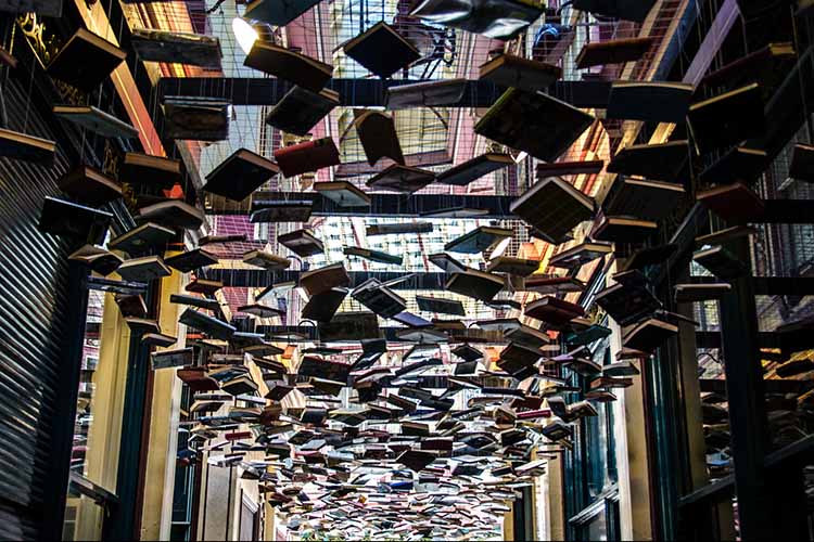 Flying books surreal art installation in Leadenhall Market